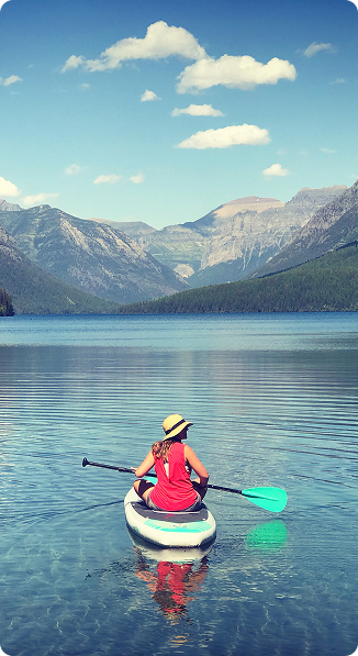 Traveler kayaking on a lake