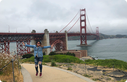 Traveler posing at the Golden Gate Bridge