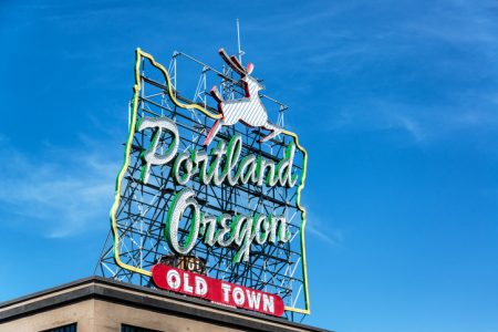 Iconic Portland, Oregon Old Town sign with an outline of Oregon and a stag
