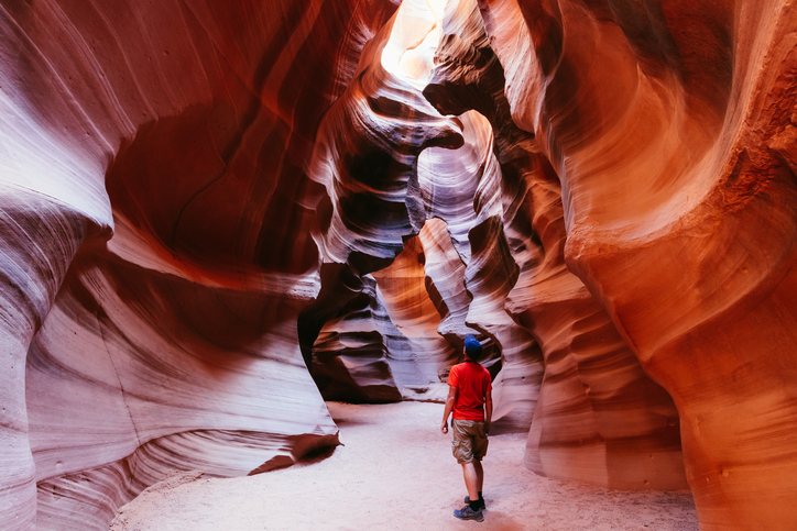 Tourist inside slot canyon, Arizona, USA
