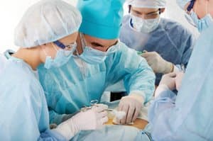 Travel nurse assisting during an operation