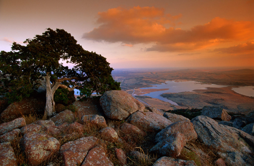 Discover Mount Scott, one of Oklahoma's most prominent mountains, at the Wichita Mountains Wildlife Refuge.