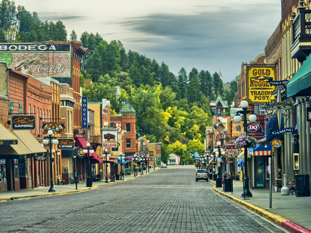 Explore the Badlands, Custer State Park, Wind Cave and Jewel Cave, Spearfish Canyon, and Deadwood.