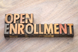 open enrollment word abstract in wood type