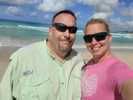 Two travel clinicians take a selfie on the beach. 