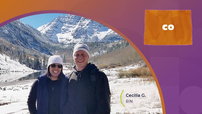 Man and woman standing in front of mountain in colorado