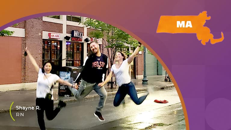 Three people jumping in the air on the streets of massachusetts