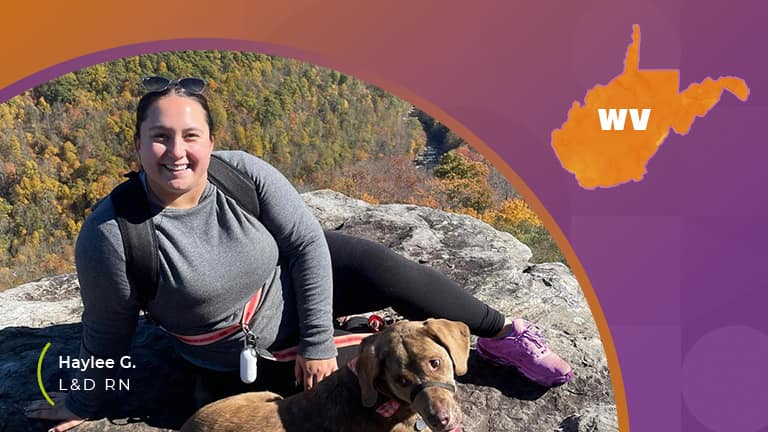 A girl hiking with her dog in west virginia