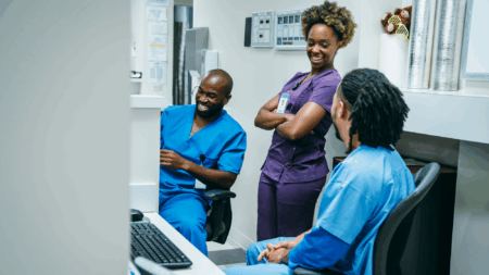 allied-health-professionals-talking-and-working-while-smiling