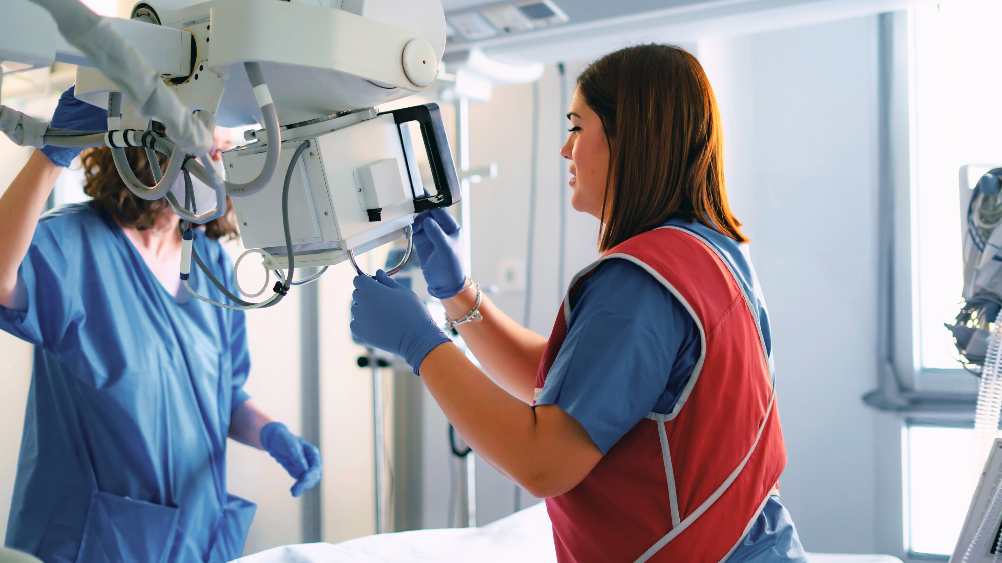Two imaging techs prepping for a scan