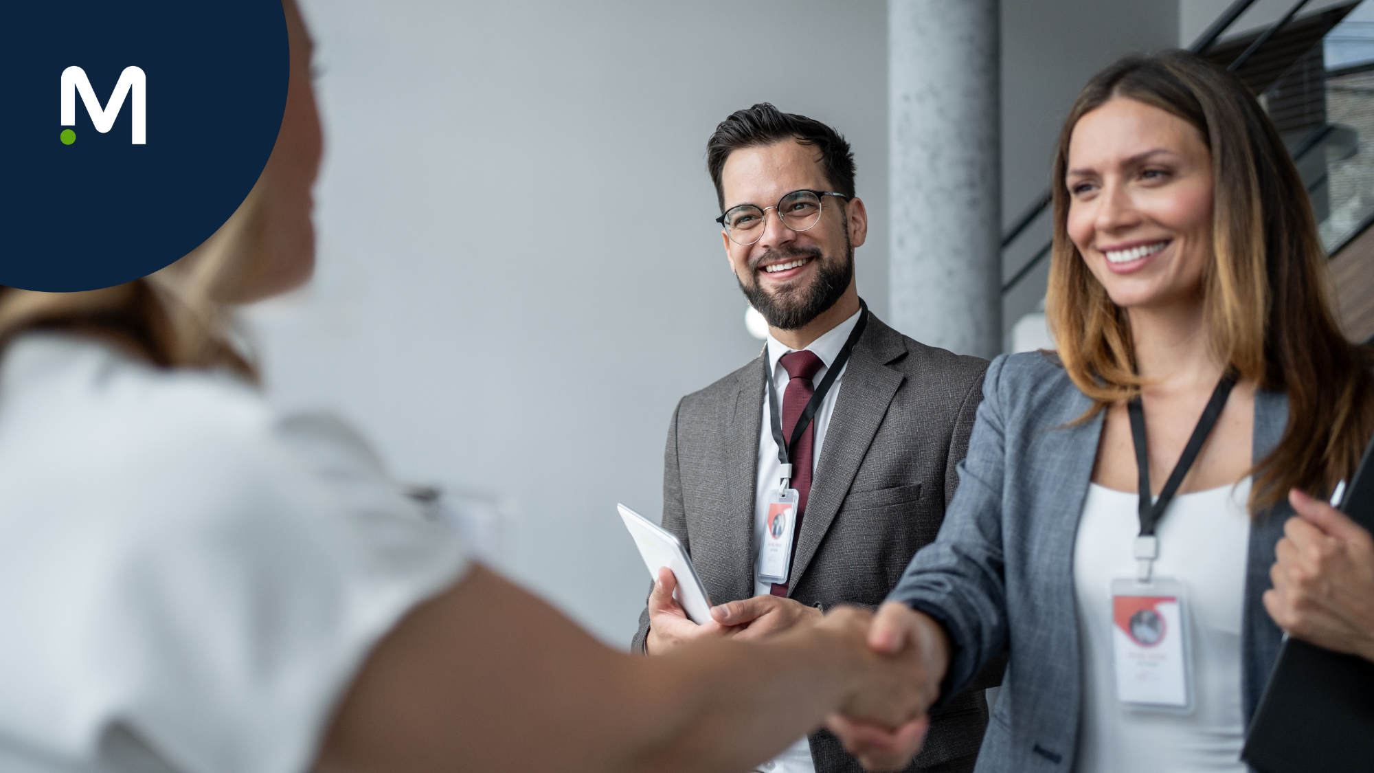 Blog header image of healthcare workforce partner shaking hands with client smiling